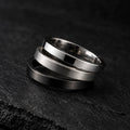 Set of three stainless steel stackable band rings in silver, brushed, and gunmetal